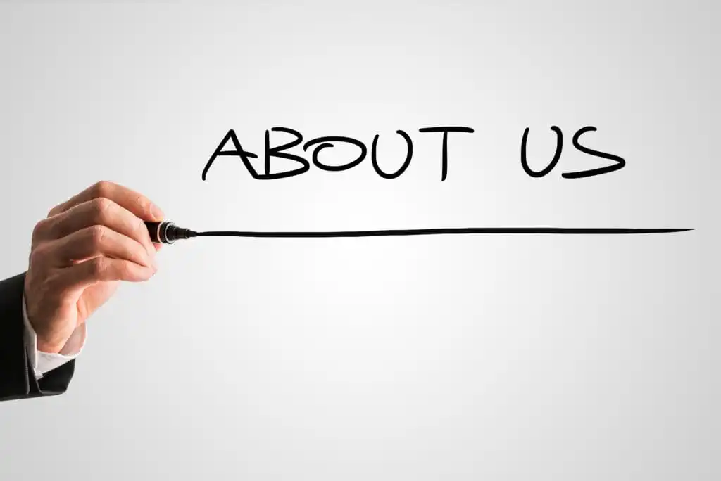 Hand drawing "About Us" on whiteboard for Canberra Packard website.